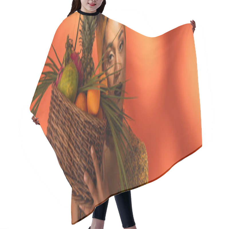 Personality  Young African American Woman Holding Basket With Exotic Fruits Near Face On Orange, Banner Hair Cutting Cape