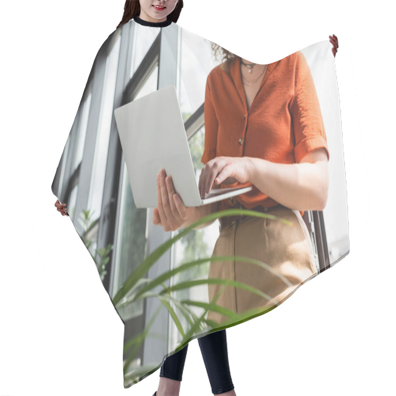 Personality  Cropped View Of Young Businesswoman Using Laptop Next To Green Plants In Modern Office  Hair Cutting Cape