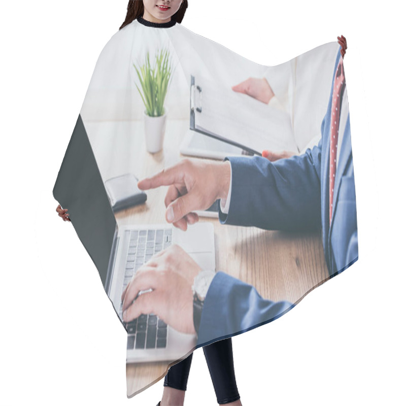 Personality  Cropped View Of Businessman Pointing With Finger At Laptop Monitor Near Colleague Holding Clipboard Hair Cutting Cape