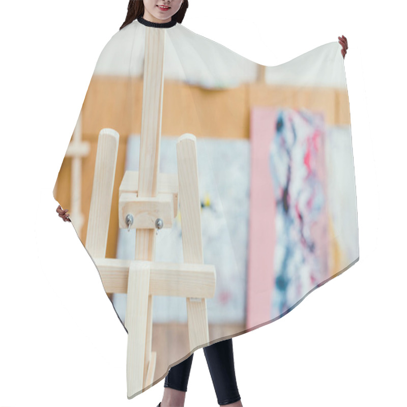 Personality  Selective Focus Of Wooden Easel In Painting Studio Hair Cutting Cape