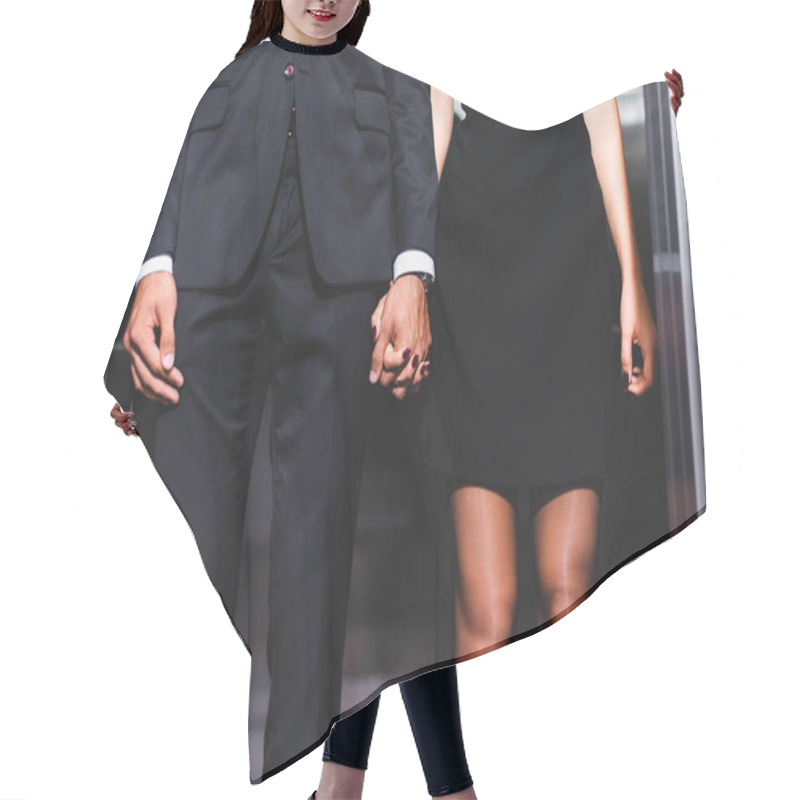 Personality  Cropped View Of Business Couple Holding Hands In Office Elevator  Hair Cutting Cape