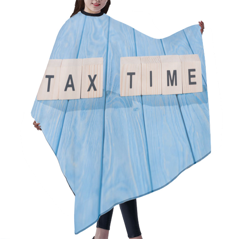 Personality  Close Up View Of Arranged Wooden Blocks Into Tax Time Phrase On Blue Wooden Surface  Hair Cutting Cape