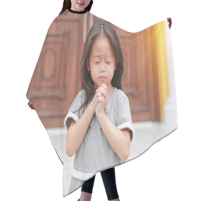 Personality  Little Asian Girl Stance Praying At The Church. Hands Folded In Prayer Concept For Faith, Spirituality And Religion. Hair Cutting Cape