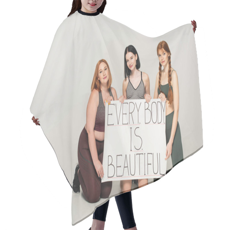 Personality  Body Positive Women In Sportswear Holding Placard With Every Body Is Beautiful Lettering On Grey Background Hair Cutting Cape