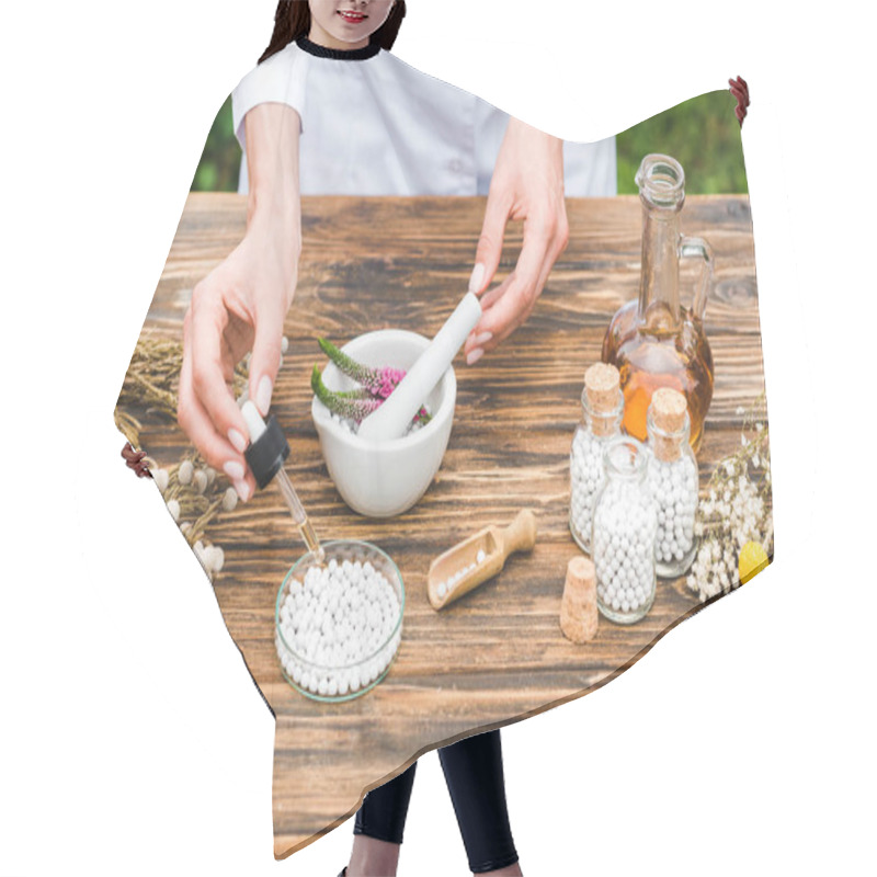 Personality  Cropped View Of Woman Holding Pipette Near Small Round Pills On Wooden Table  Hair Cutting Cape