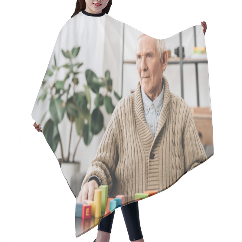 Personality  Senior Man Sitting Near Wooden Toys At Home Hair Cutting Cape