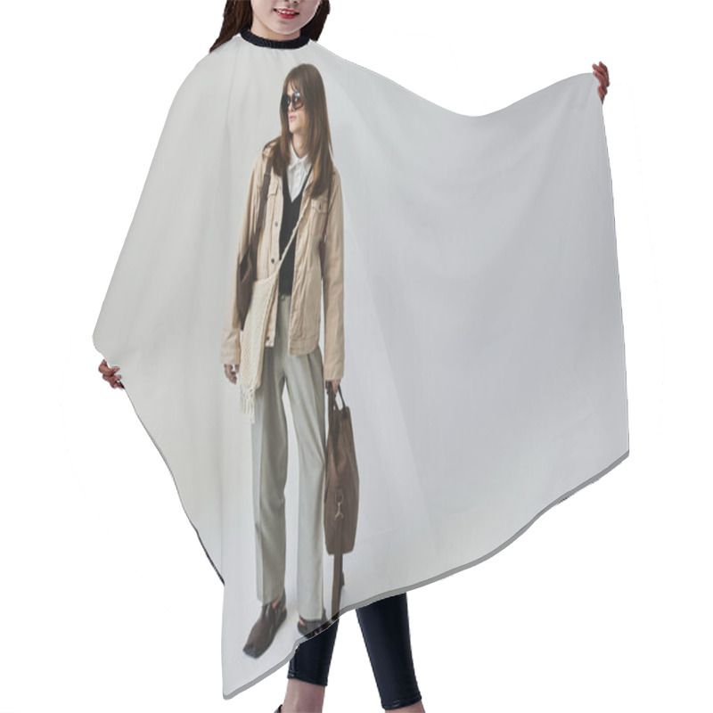 Personality  A Young Man Stands Confidently, Flaunting His Trendy Outfit In A Chic Indoor Setting. Hair Cutting Cape