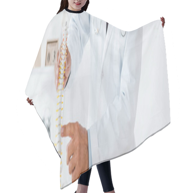 Personality  Panoramic Shot Of Doctor In White Coat Pointing With Finger At Spine Model  Hair Cutting Cape