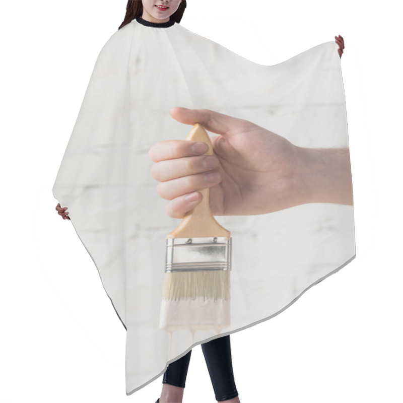 Personality  Cropped Image Of Man Holding Brush In White Paint Hair Cutting Cape