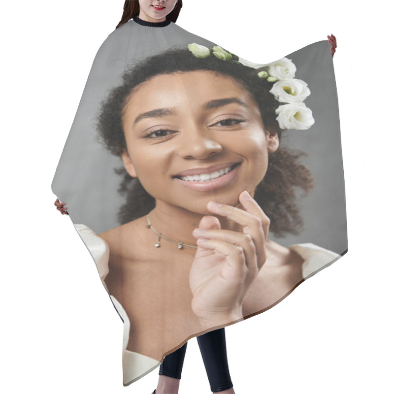 Personality  A Beautiful African American Bride In A White Wedding Dress With Flowers In Her Hair Smiles Radiantly Against A Grey Backdrop. Hair Cutting Cape