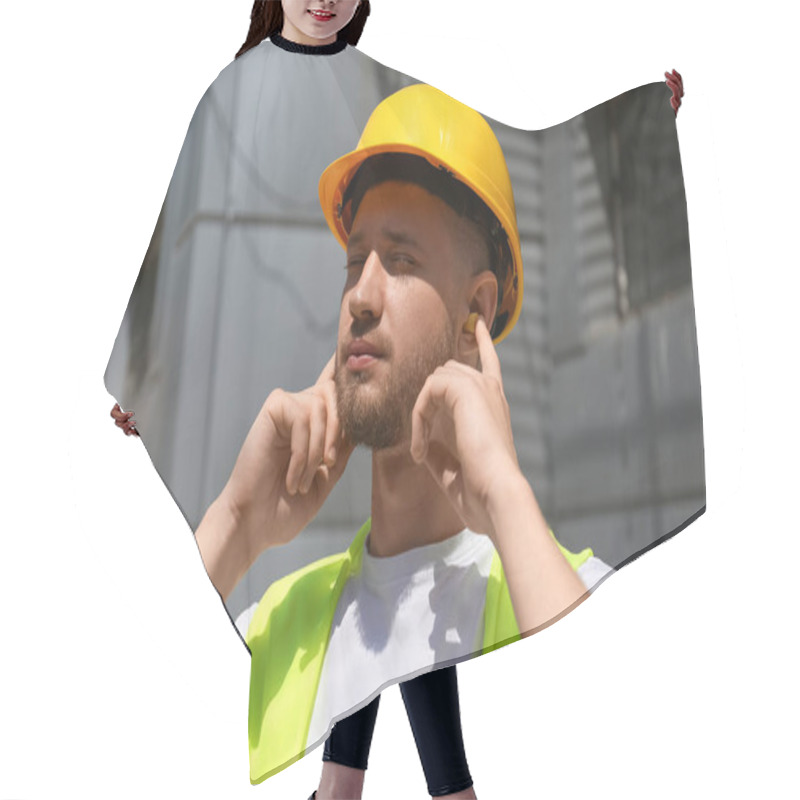 Personality  Male Worker Putting Ear Plugs Outdoors Hair Cutting Cape