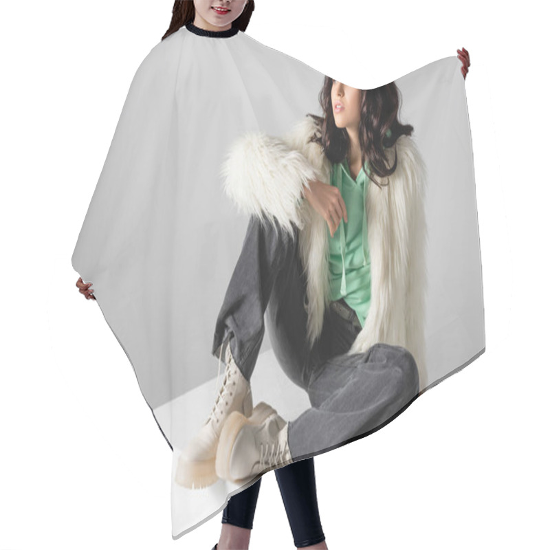 Personality  Brunette Young Woman In Faux Fur Jacket Posing On Cube On White Background Hair Cutting Cape