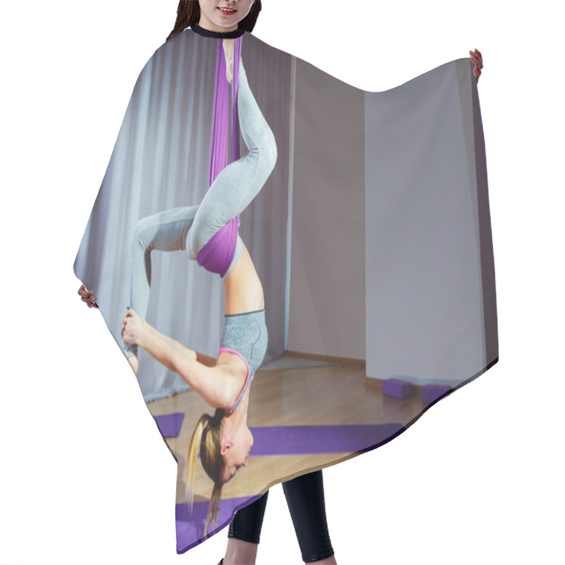 Personality  Young Woman Posing Doing Aerial Yoga Exercise With Hammock Upside Down. Hair Cutting Cape