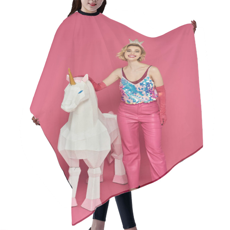 Personality  Woman In Pink Sparkly Outfit Poses With White Unicorn On Pink Background. Hair Cutting Cape