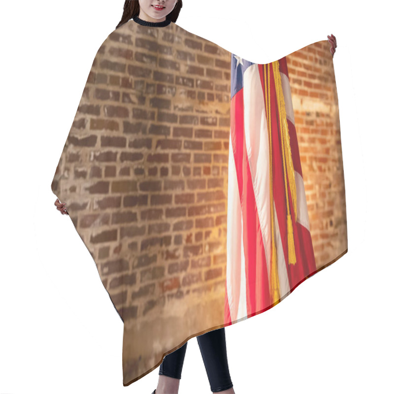 Personality  American Flag On Stand, Against Old Brick Wall, With Copy Space. Hair Cutting Cape