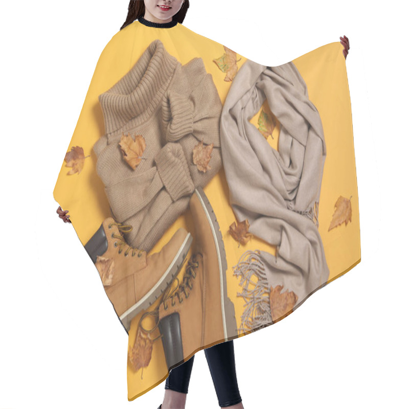 Personality  Flat Lay Composition With Sweater And Dry Leaves On Yellow Background. Autumn Season Hair Cutting Cape