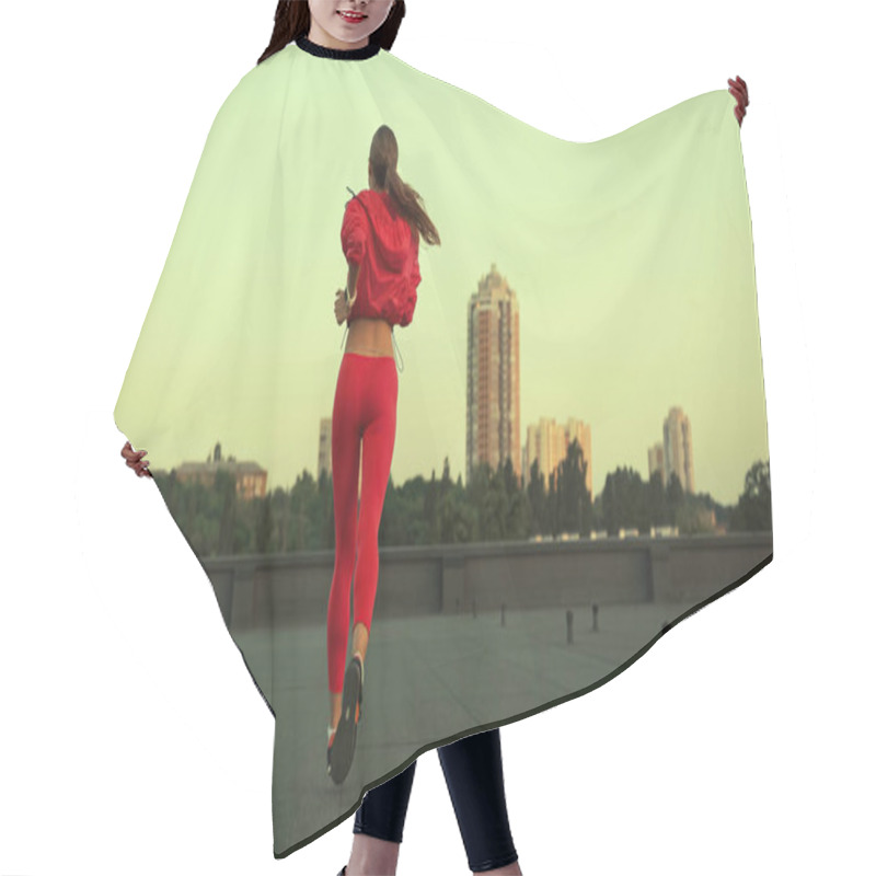 Personality  Back View Of Sportswoman Jogging On Roof In Evening  Hair Cutting Cape