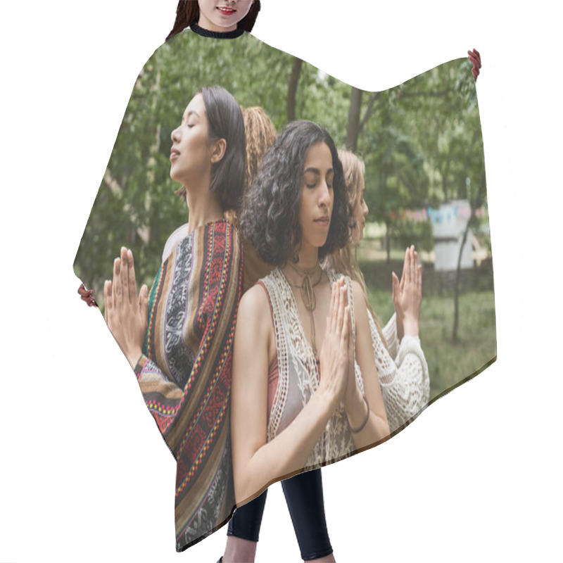 Personality  Multiracial Woman With Closed Eyes Doing Praying Hands Gesture Near Friends In Retreat Center Hair Cutting Cape