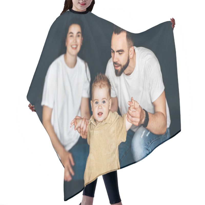 Personality  A Man, Woman, And Child Standing Together, Smiling And Posing For A Photograph. Hair Cutting Cape