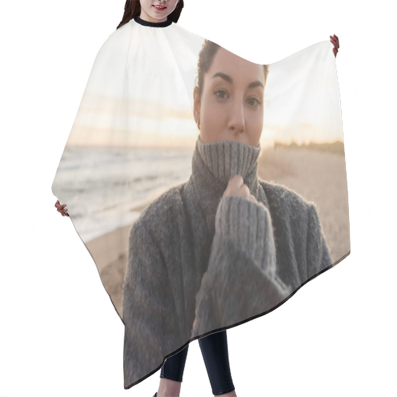 Personality  Portrait Of Woman In Coat And Sweater Looking At Camera On Beach In Spain  Hair Cutting Cape