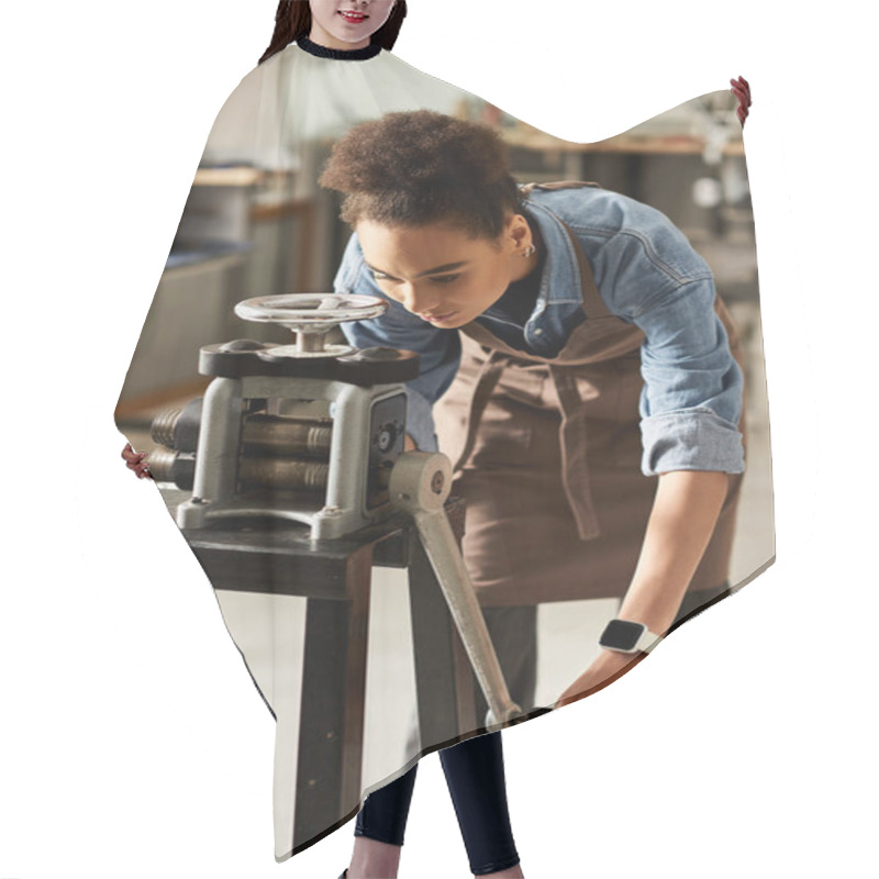 Personality  A Talented Woman Focuses Intently As She Operates A Metal Press, Crafting Elegant Jewelry Pieces. Hair Cutting Cape