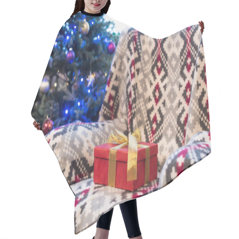 Personality  Red Gift Box With Golden Bow On Couch And Decorated Christmas Tree Behind  Hair Cutting Cape