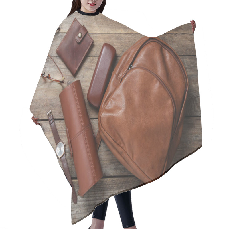 Personality  Stylish Urban Backpack And Different Items On Wooden Table, Flat Lay Hair Cutting Cape