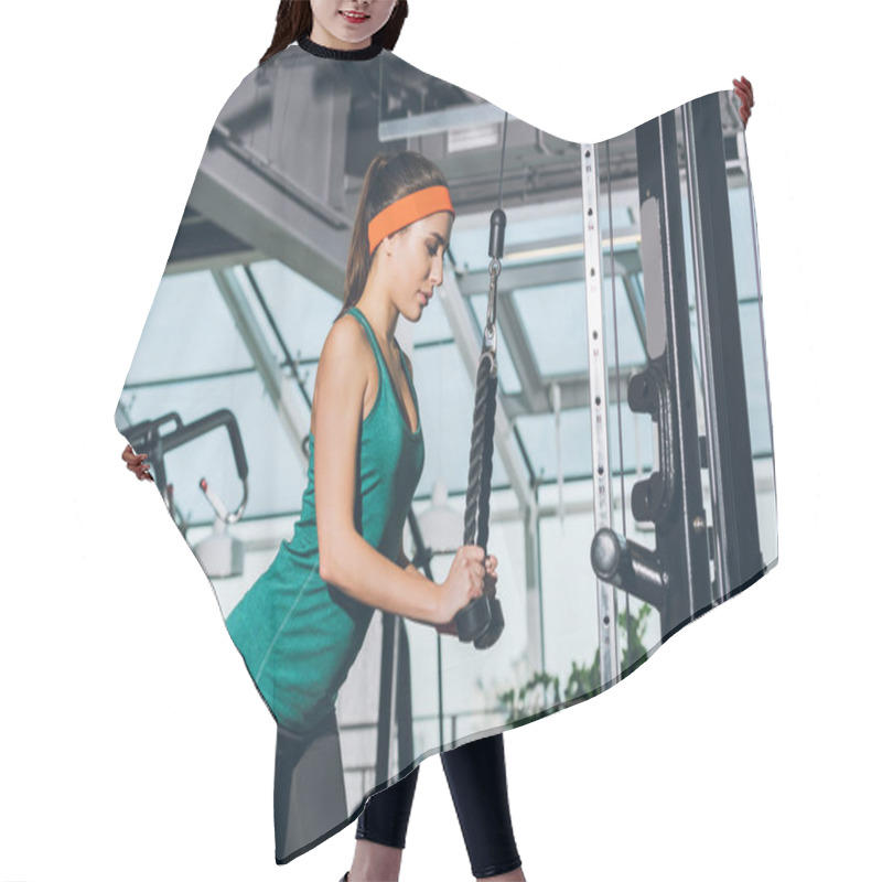 Personality  Sporty Woman Training On  Training Apparatus At Gym Hair Cutting Cape