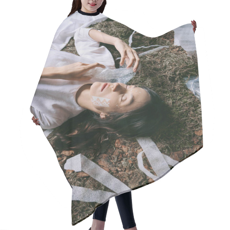 Personality  A Woman Lays Surrounded By Plastic Waste, Her Eyes Closed And Expression Solemn. Hair Cutting Cape