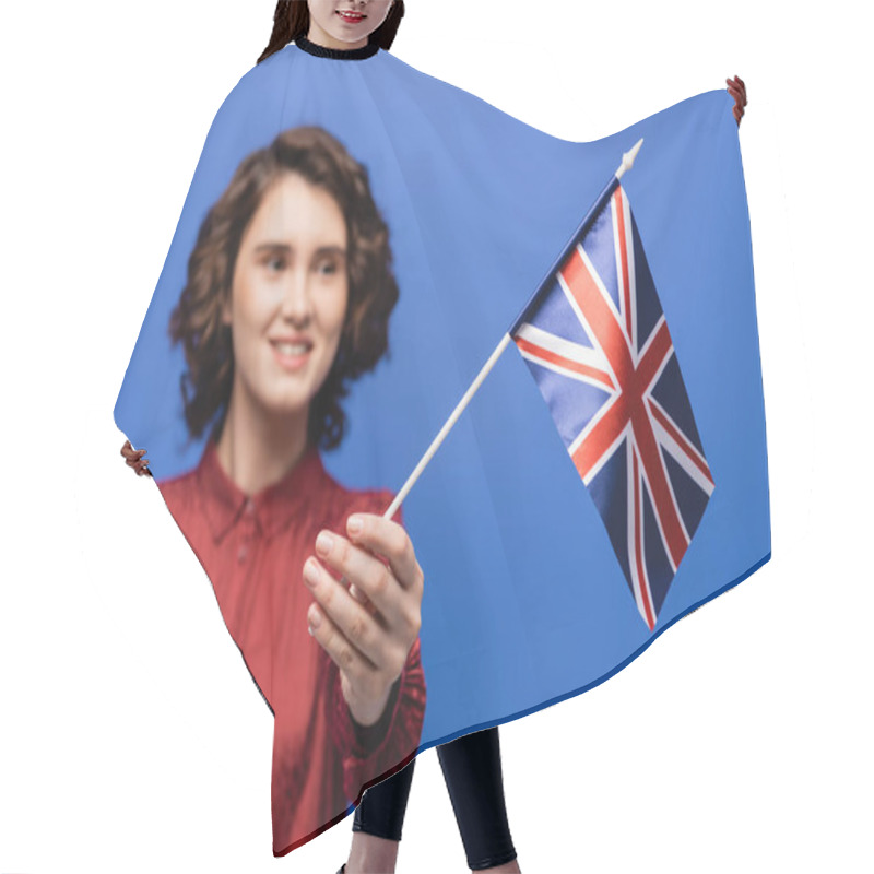 Personality  Joyful Student With Curly Hair Looking At Flag Of United Kingdom Isolated On Blue  Hair Cutting Cape