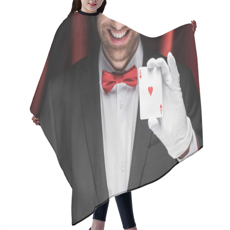 Personality  Cropped View Of Smiling Magician Holding Playing Cards In Circus With Red Curtains Hair Cutting Cape