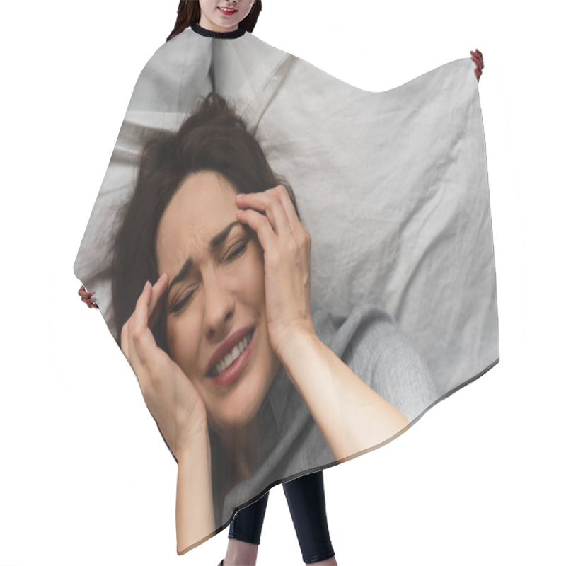 Personality  Top View Of Brunette Woman Suffering From Pain And Touching Head While Lying On Bed  Hair Cutting Cape