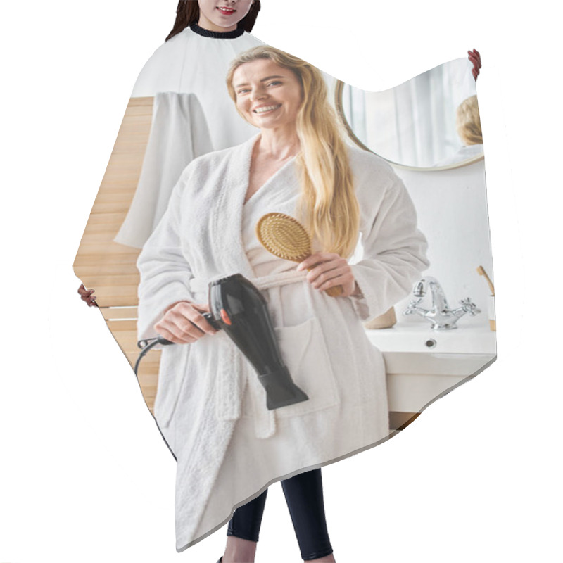 Personality  Appealing Jolly Woman In Bathrobe Using Hair Dryer And Brush On Her Long Hair And Looking At Camera Hair Cutting Cape