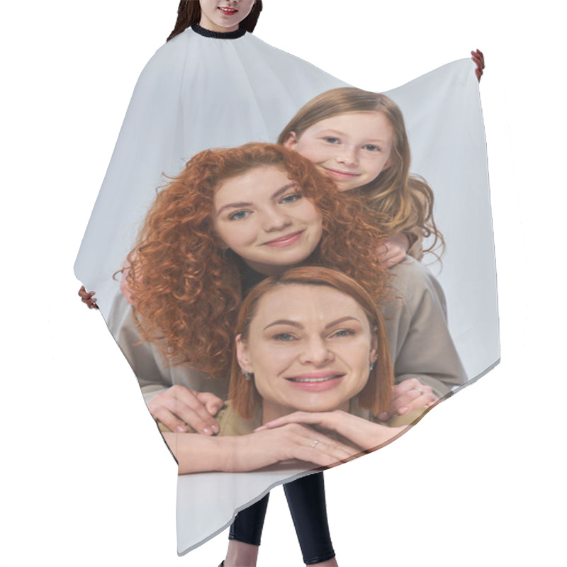 Personality  Three Female Generations, Happy Redhead Family In Beige Coats Smiling On Grey Backdrop, Family Bond Hair Cutting Cape