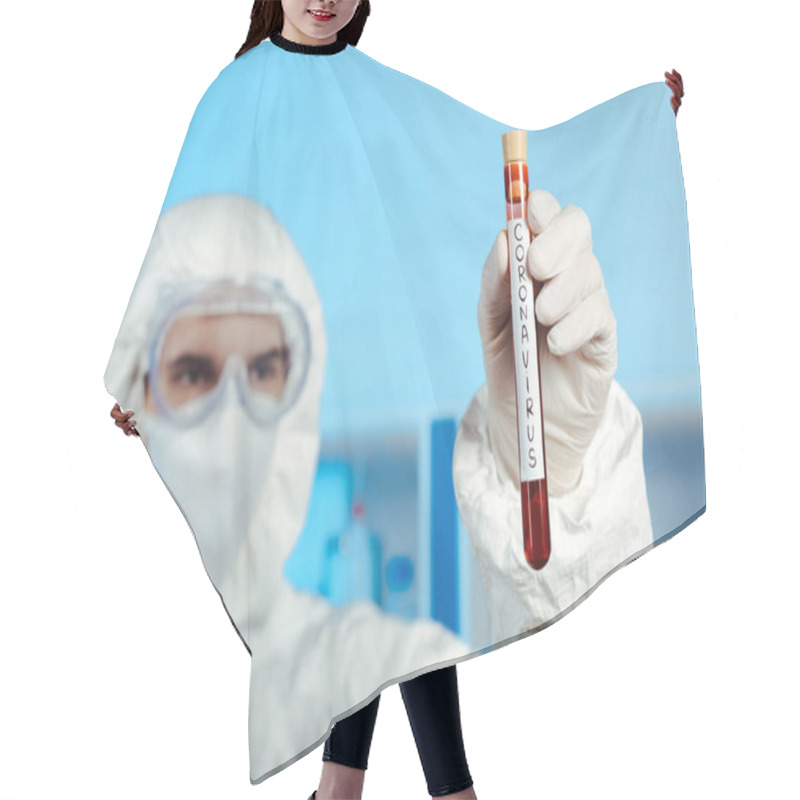 Personality  Selective Focus Of Scientist In Hazmat Suit, Medical Mask And Goggles Holding Test Tube With Coronavirus Lettering  Hair Cutting Cape