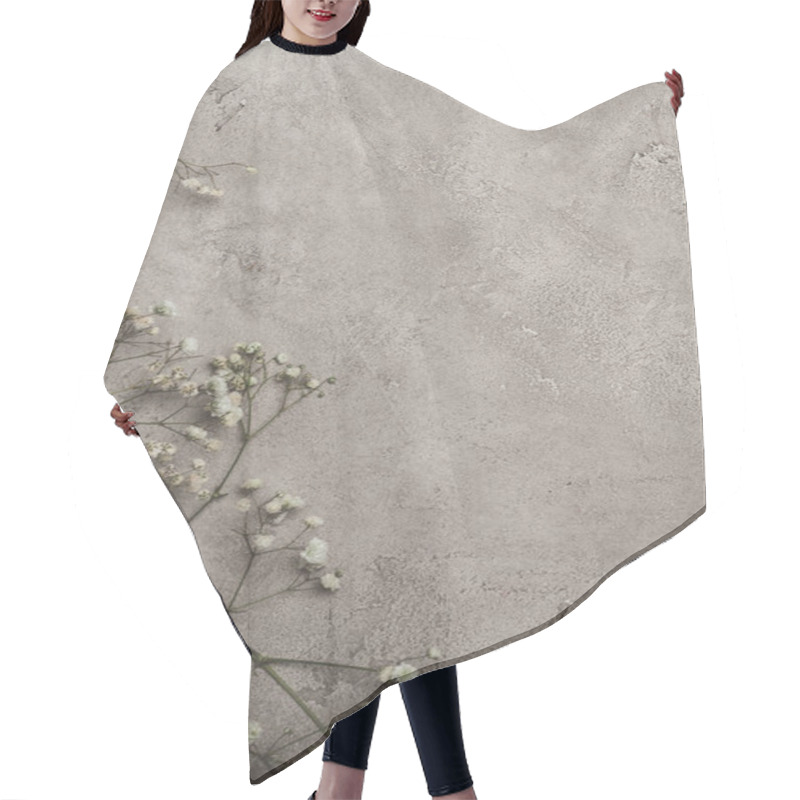 Personality  Top View Of White Flowers On Concrete Surface With Copy Space  Hair Cutting Cape