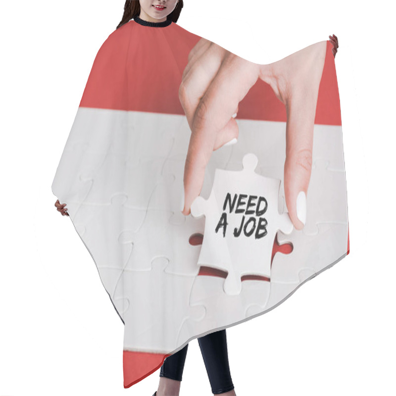 Personality  Cropped Of Woman Holding Jigsaw With Need A Job Lettering Near Connected White Puzzle Pieces On Red Hair Cutting Cape