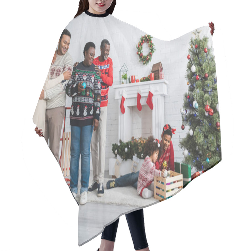 Personality  Happy African American Family Looking At Brother And Sister Playing Near Christmas Tree In Living Room Hair Cutting Cape