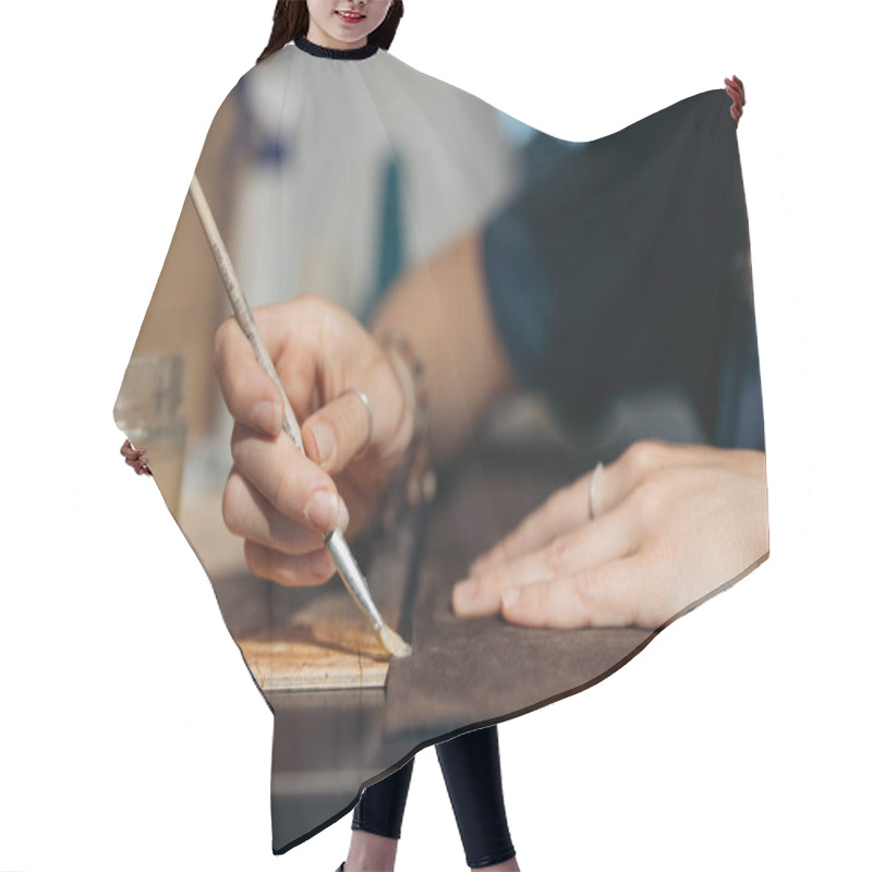 Personality  Leatherworker Applying Glue To Fabric For Crafting A Bag Hair Cutting Cape