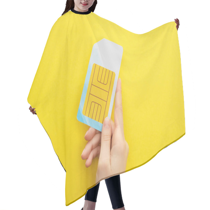 Personality  Cropped View Of Woman Holding Sim Card On Yellow Background Hair Cutting Cape