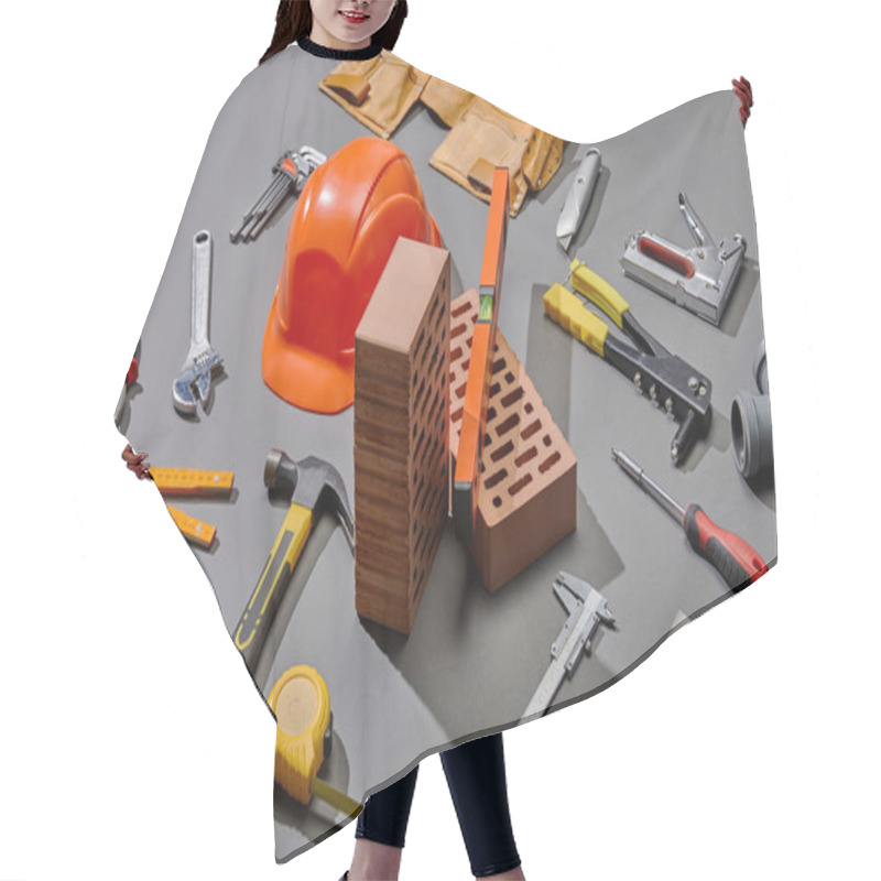 Personality  High Angle View Of Helmet, Bricks And Industrial Tools On Grey Background Hair Cutting Cape