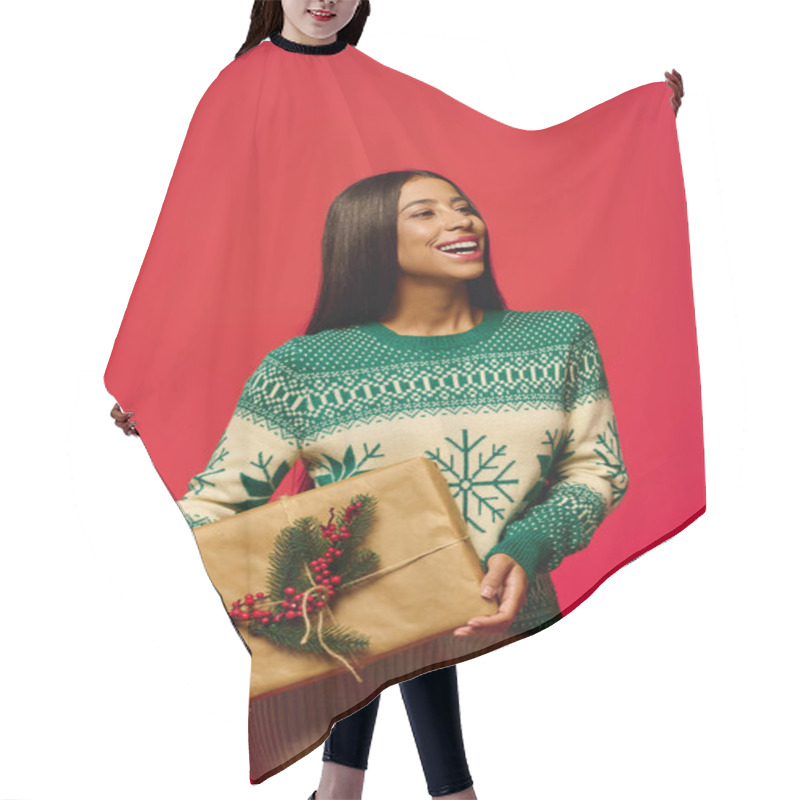 Personality  A Joyful Young Woman Smiles As She Presents A Beautifully Wrapped Gift For The Holidays. Hair Cutting Cape