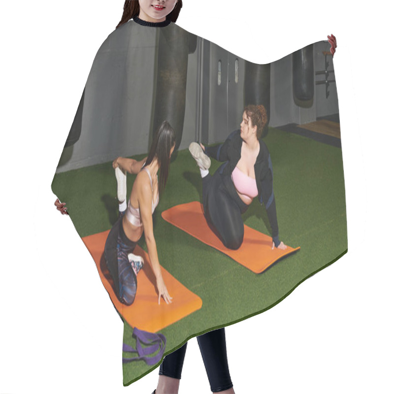 Personality  Two Women Are Dedicatedly Practicing Stretch Exercises On Yoga Mats In A Gym Setting. Hair Cutting Cape