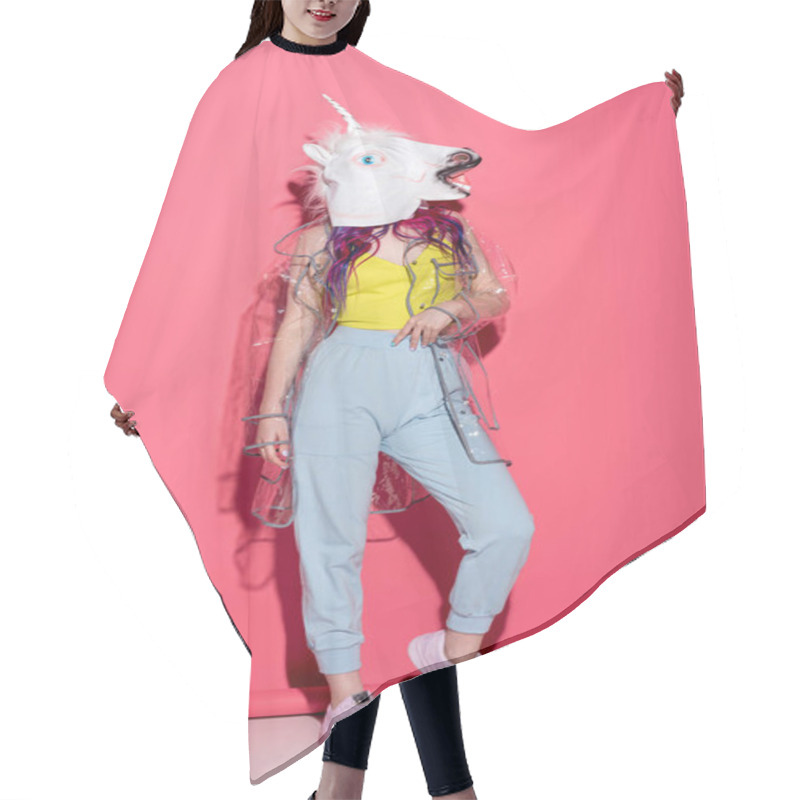 Personality  Stylish Woman In Fashionable Transparent Raincoat And Unicorn Mask On Red Hair Cutting Cape