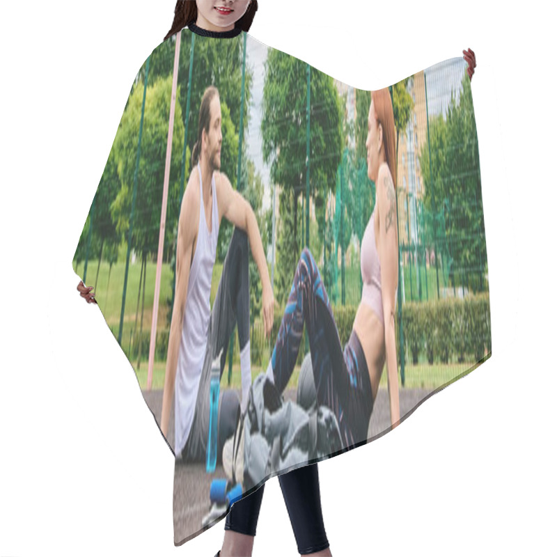 Personality  A Woman In Sportswear, After Exercising, Sit On The Ground With Personal Trainer, Showcasing Determination And Motivation. Hair Cutting Cape