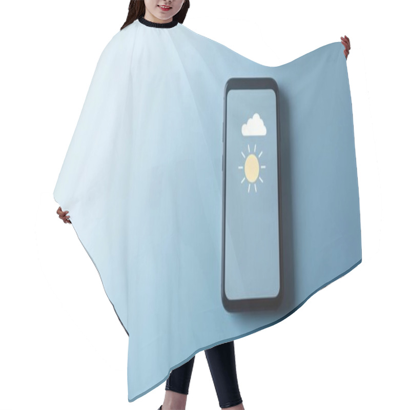 Personality  A Modern Smartphone Displaying A Sunny Weather Forecast Against A Blue Background. Hair Cutting Cape