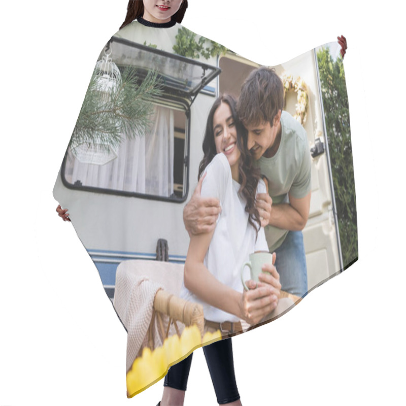 Personality  Smiling Man Hugging Cheerful Girlfriend With Closed Eyes Holding Cup Near Camper Van  Hair Cutting Cape