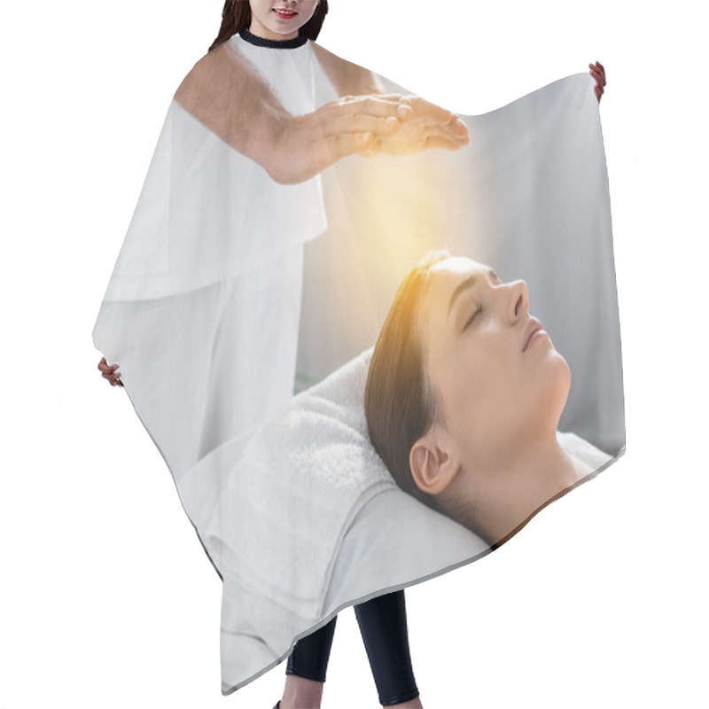 Personality  Cropped View Of Healer Standing Near Patient On Massage Table And Cleaning Aura Hair Cutting Cape