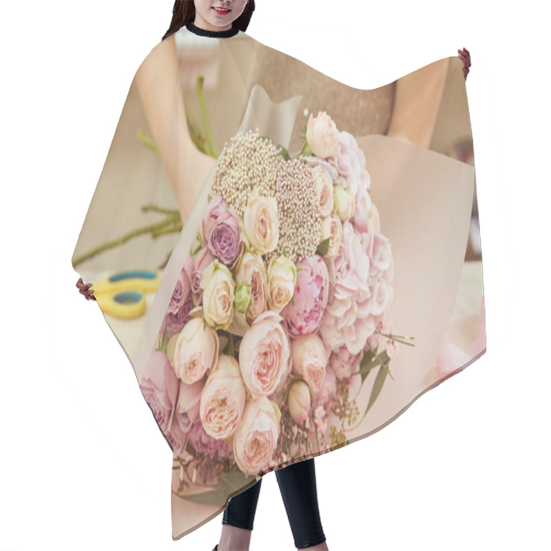 Personality   Florist Wrapping Bouquet Of Roses And Peonies At Workspace Hair Cutting Cape