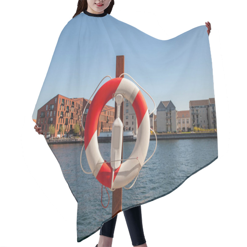 Personality  Close Up View Of Floating Ring With City River And Buildings On Background In Copenhagen, Denmark Hair Cutting Cape